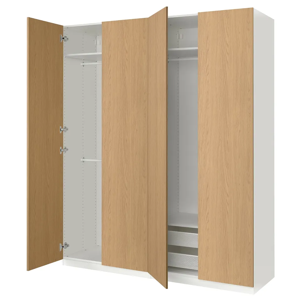 A white and light wooden PAX wardrobe with open doors, revealing shelves and storage space.