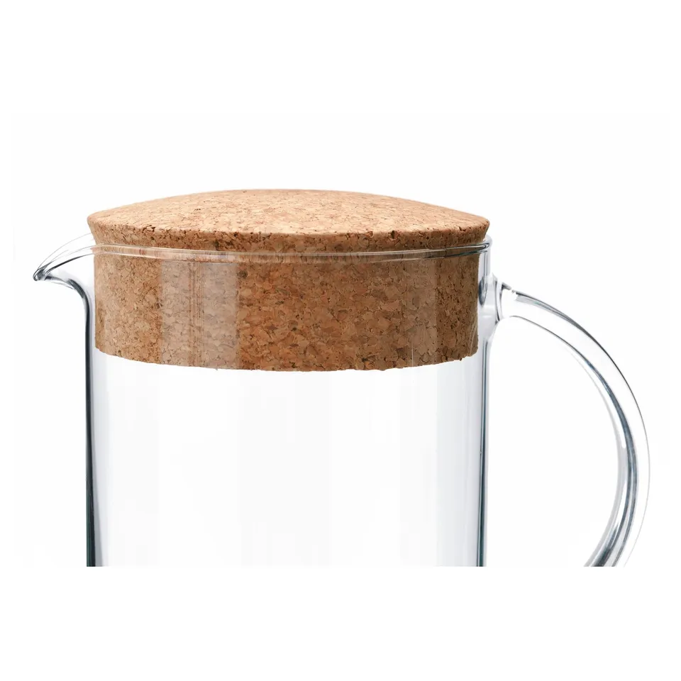 Clear glass pitcher with cork lid, designed by IKEA. Sturdy, transparent body with easy-grip handle and secure lid.