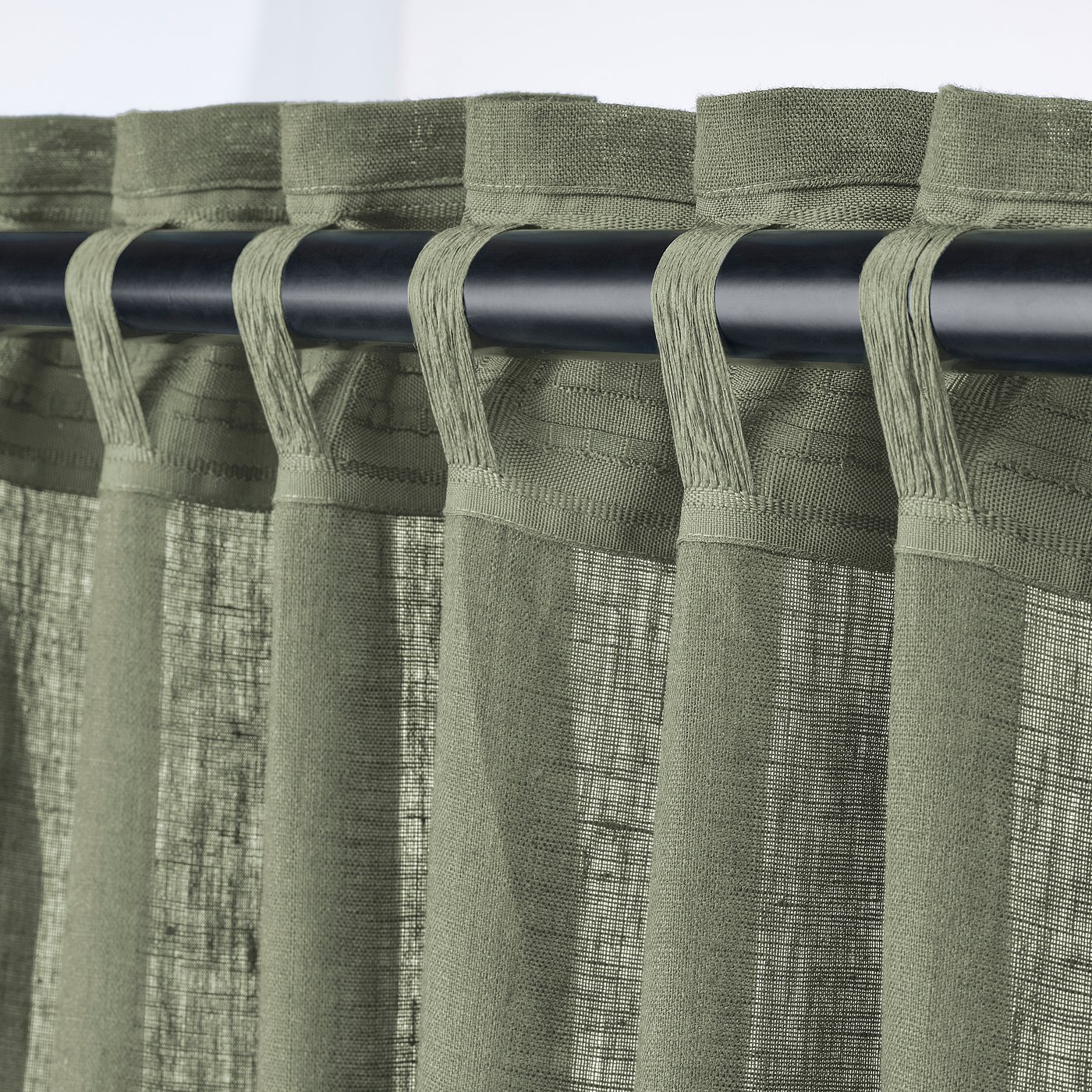 Green semi-sheer curtains with rod pocket header.