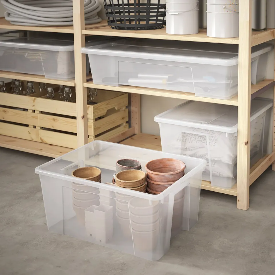 Transparent ikea SAMLA bin for wooden objects, stacks, fits shelves.