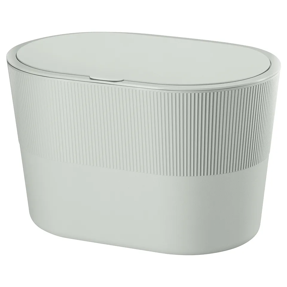 KINNASJÖ: white, oval rubbish bin with vertical grooves, lid, and a sleek, modern design.