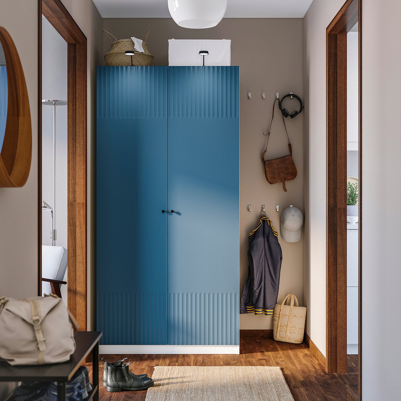 Modern blue PAX wardrobe against wall, tall with hooks for accessories.