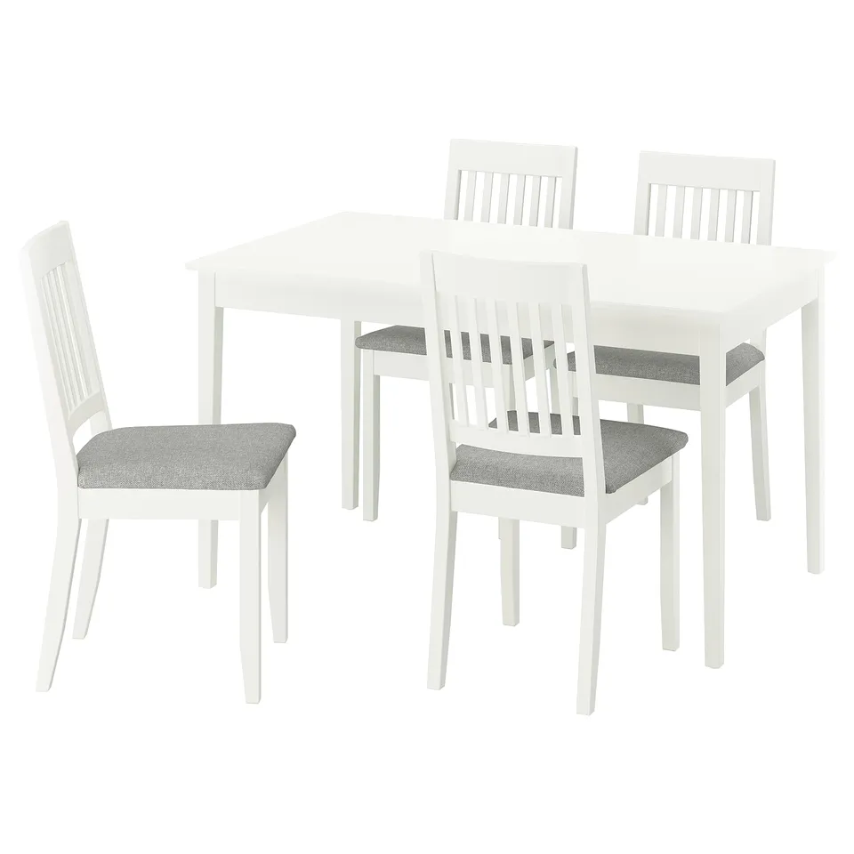 White NÄSINGE dining set with extending table and four fabric chairs.