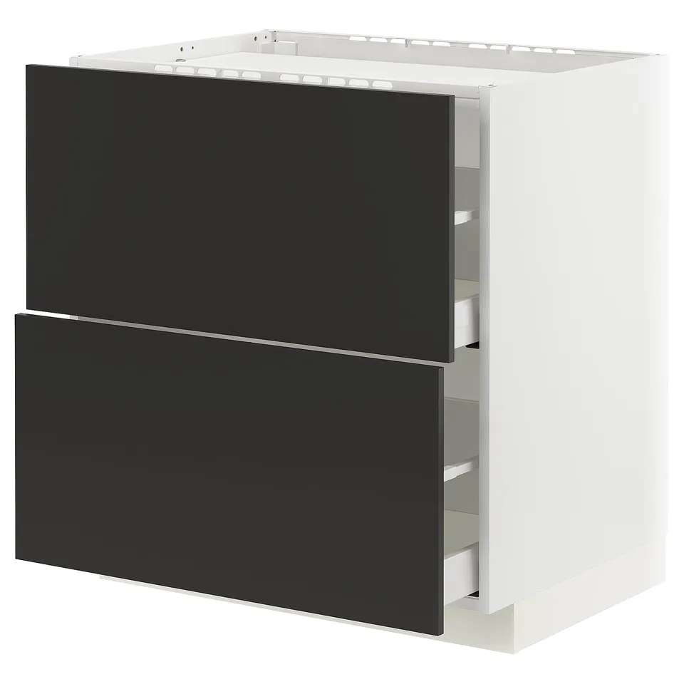 A modern, white METOD kitchen cabinet with black nickebo drawers. It full-extension drawers with a sleek, minimalist design.