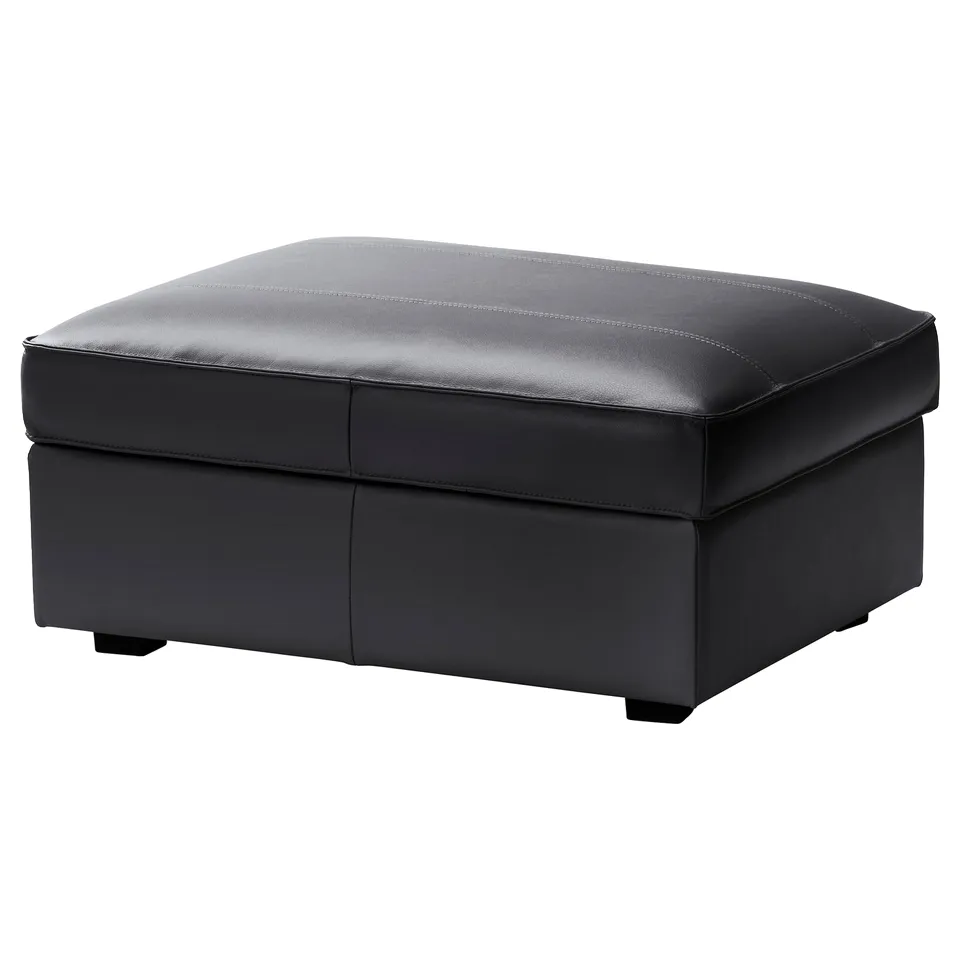 A KIVIK grey leather footstool, rectangular with clean lines and stitching details, providing both comfort and storage.