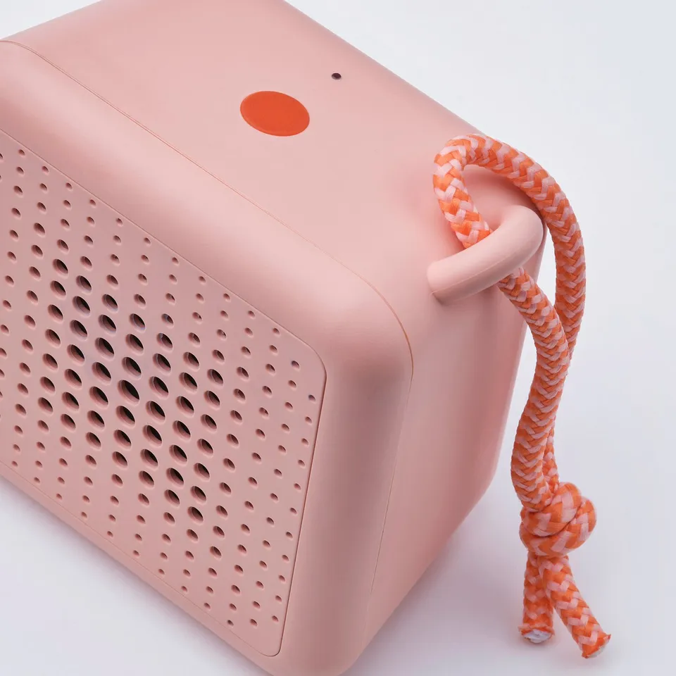 Compact, stylish, portable speaker. Comfortable braided rope handle. Perfect for travel.