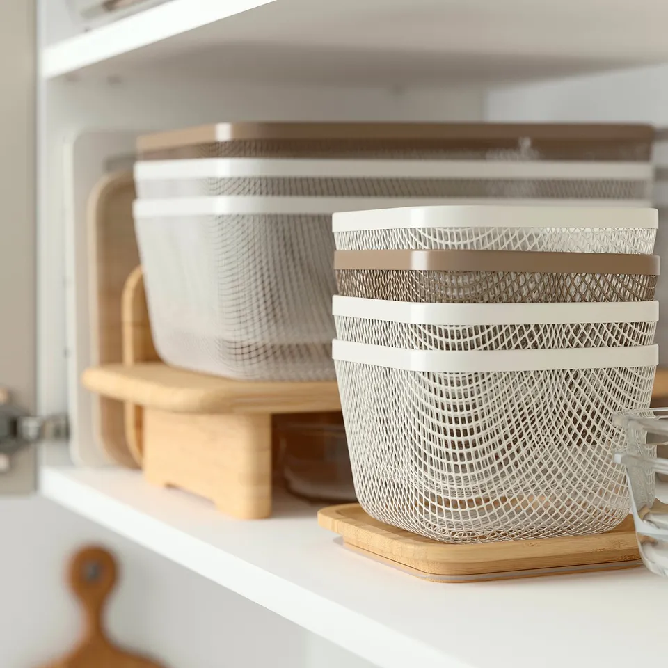 Mesh IKEA 365+ basket on shelf, allowing air circulation for fresh produce storage.