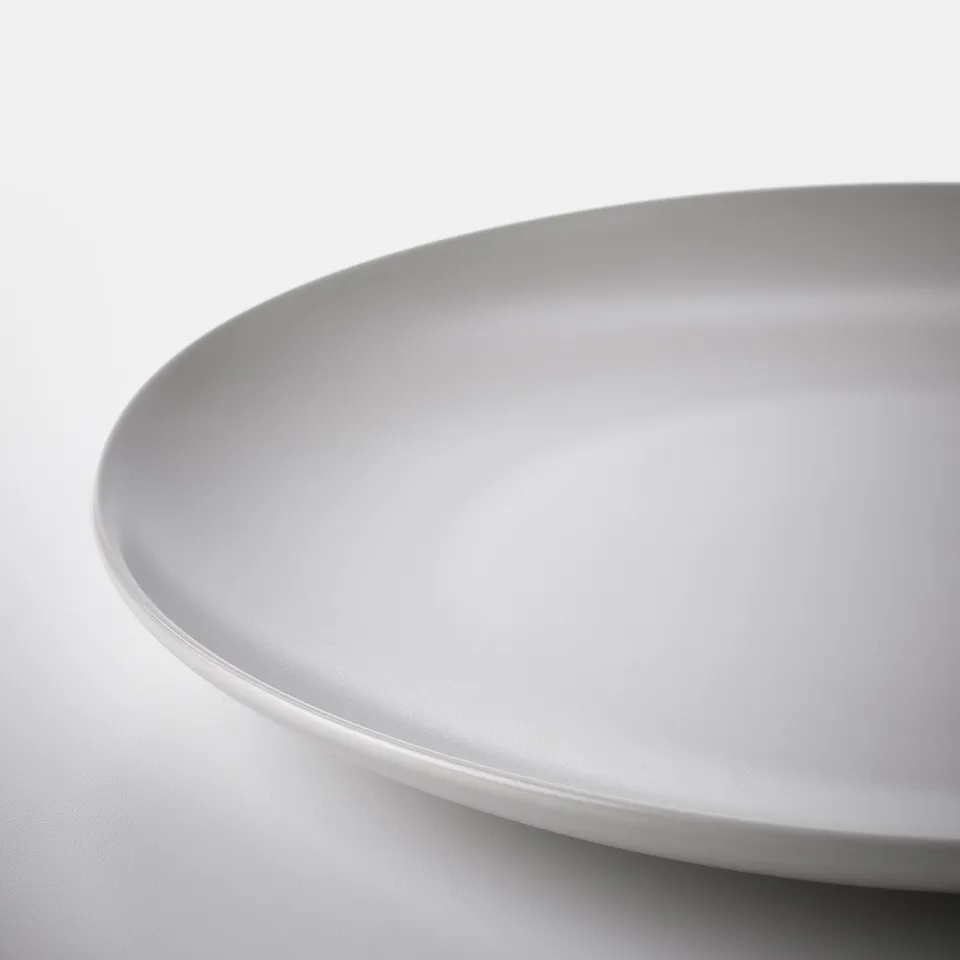 Smooth, high-quality, matte white plate with rounded edges. Simplicity and elegance in design.