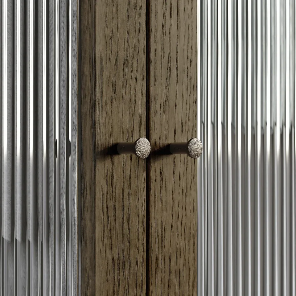 Wooden cabinet with two round silver knobs.
