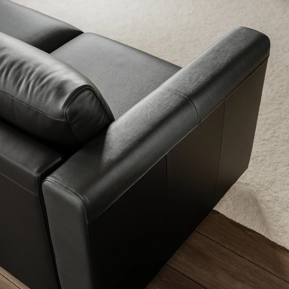 Premium leather sofa with smooth, supportive cushions, showcasing quality craftsmanship.