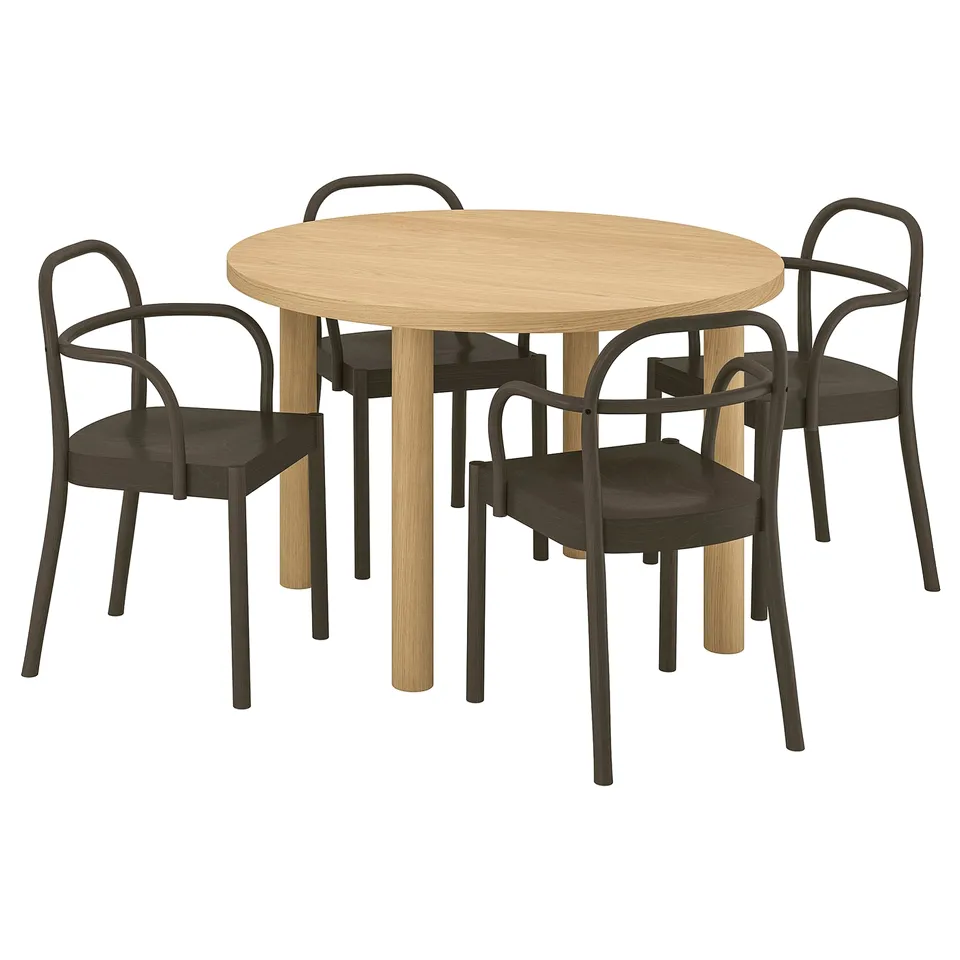 Modern scandinavian dining set with round light wood table and dark wood chairs.