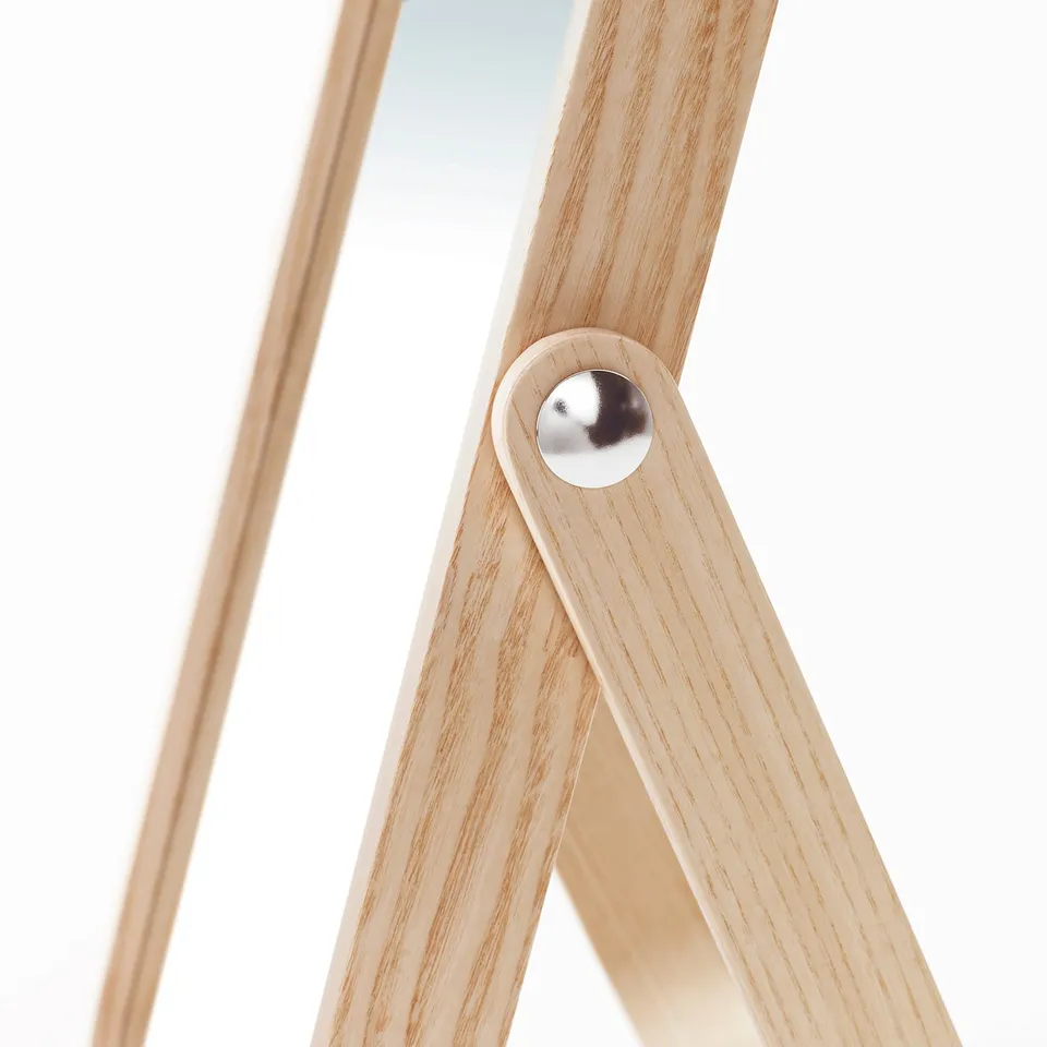 Image shows a wooden-framed mirror with a sturdy, angled base, reflecting high-quality craftsmanship.
