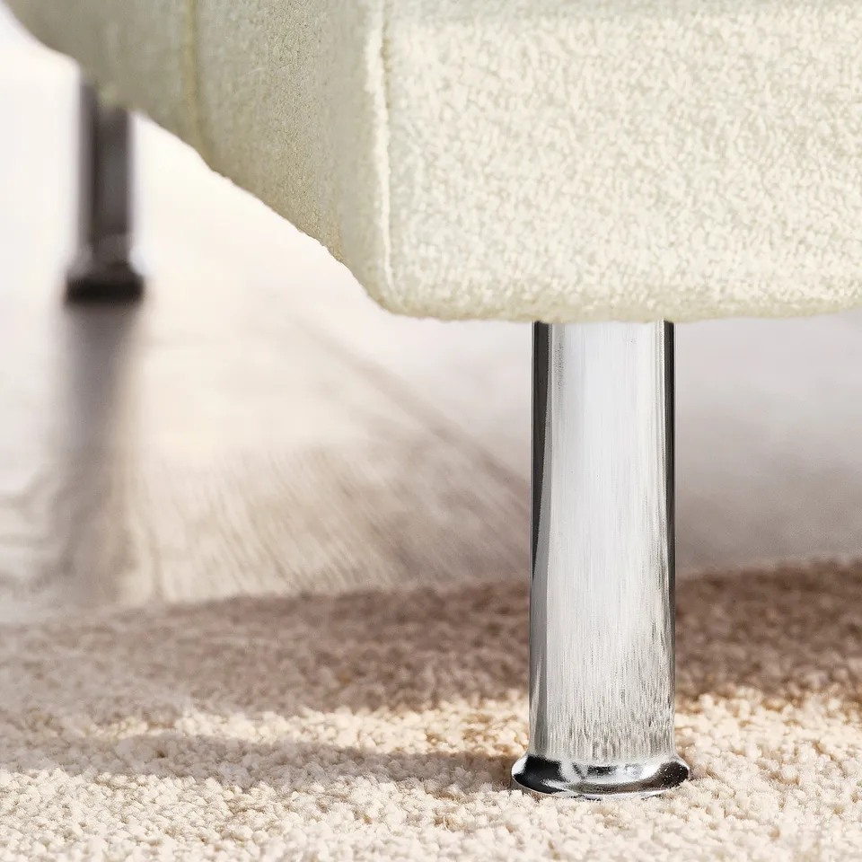 UPPÅKRA sofa leg detail; sturdy chrome finish, supportive base.