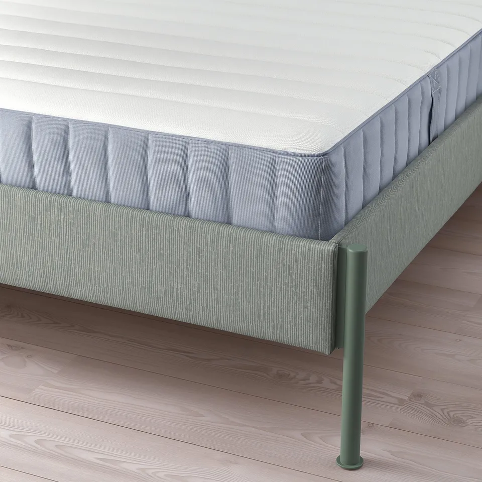 Modern bed frame with adjustable sides, soft headboard, and metal legs for easy cleaning.