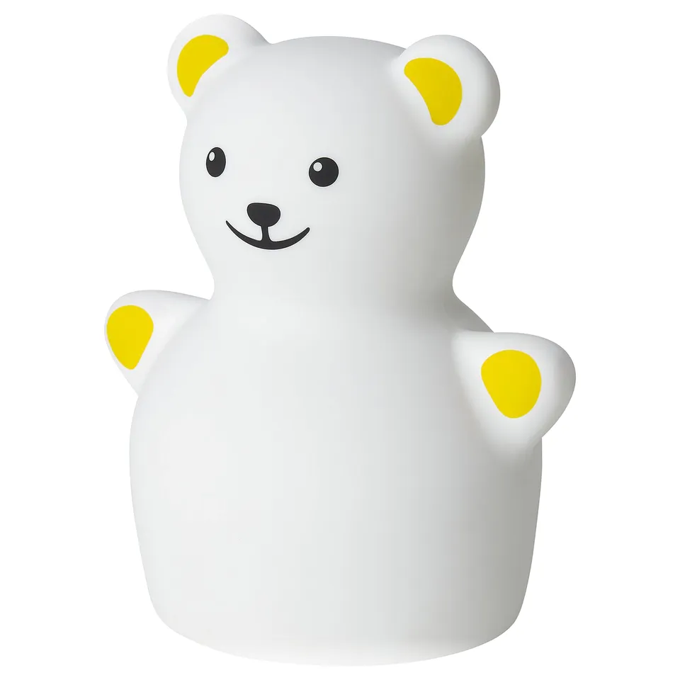 White teddy bear night light with yellow accents, made of plastic, softly glowing.