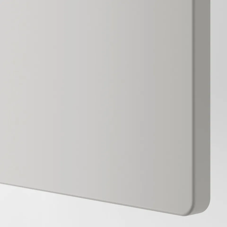 Close-up of smooth, white, modern storage unit door. Soft, rounded corners for safety.
