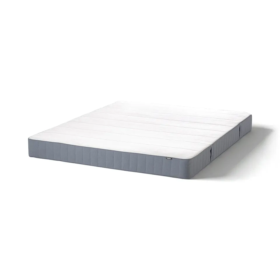 White and grey VESTMARKA mattress on side, rectangular, foam and spring core.