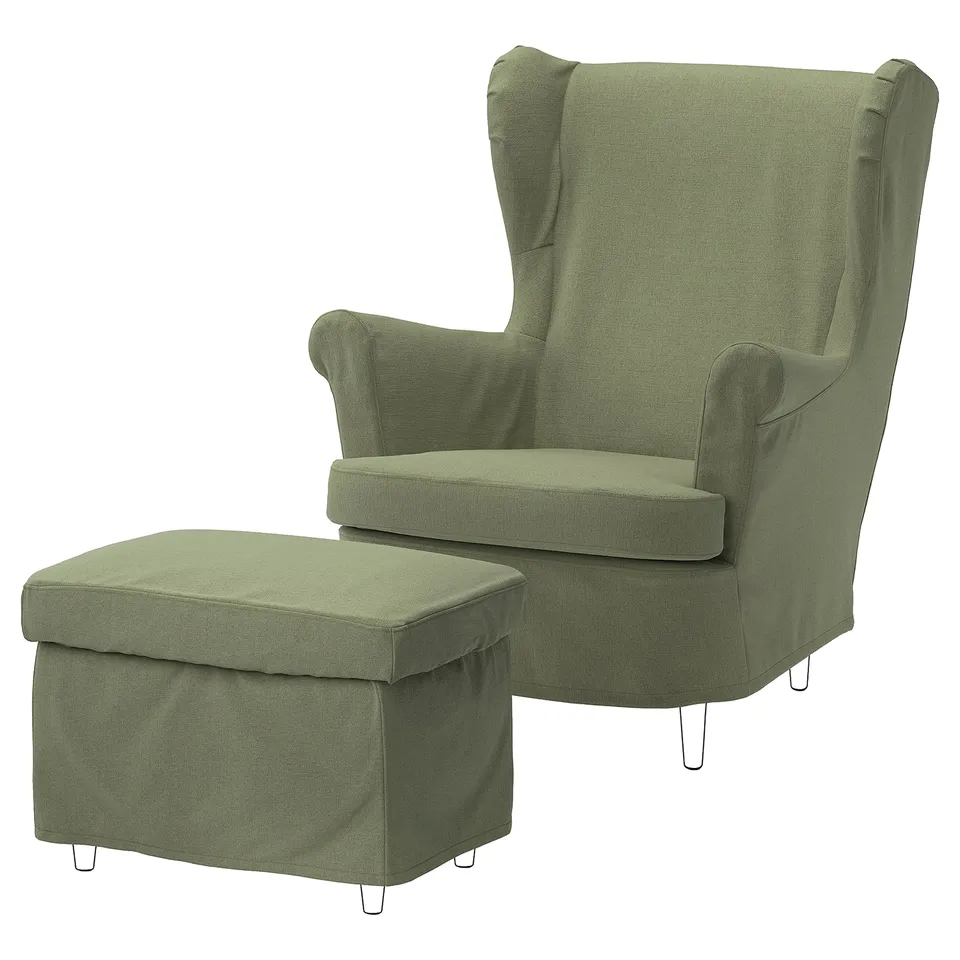 Green STRANDMON wing chair & footstool, sleek design with comfortable armrests and matching slipcovers.
