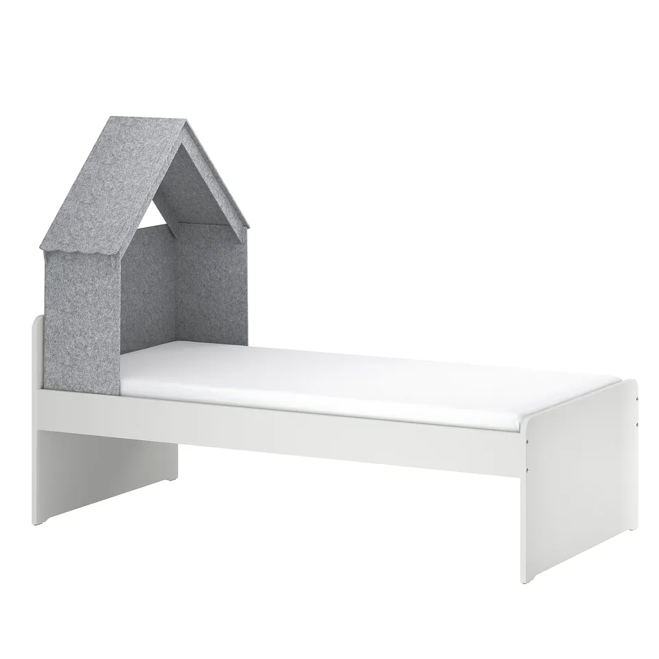 Modern kids bed with grey canopy, rounded corners.