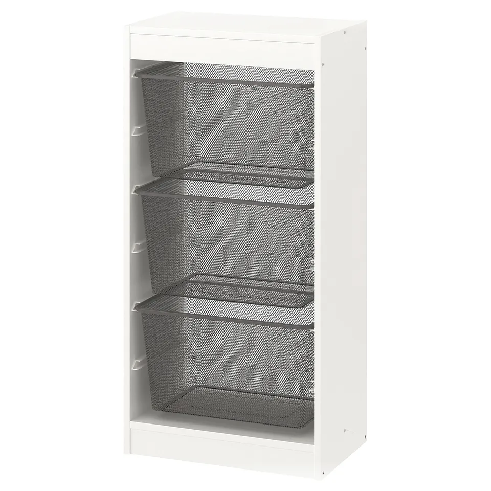 A white TROFAST storage unit with three mesh drawers. Its tall, rectangular, and modern design elements.