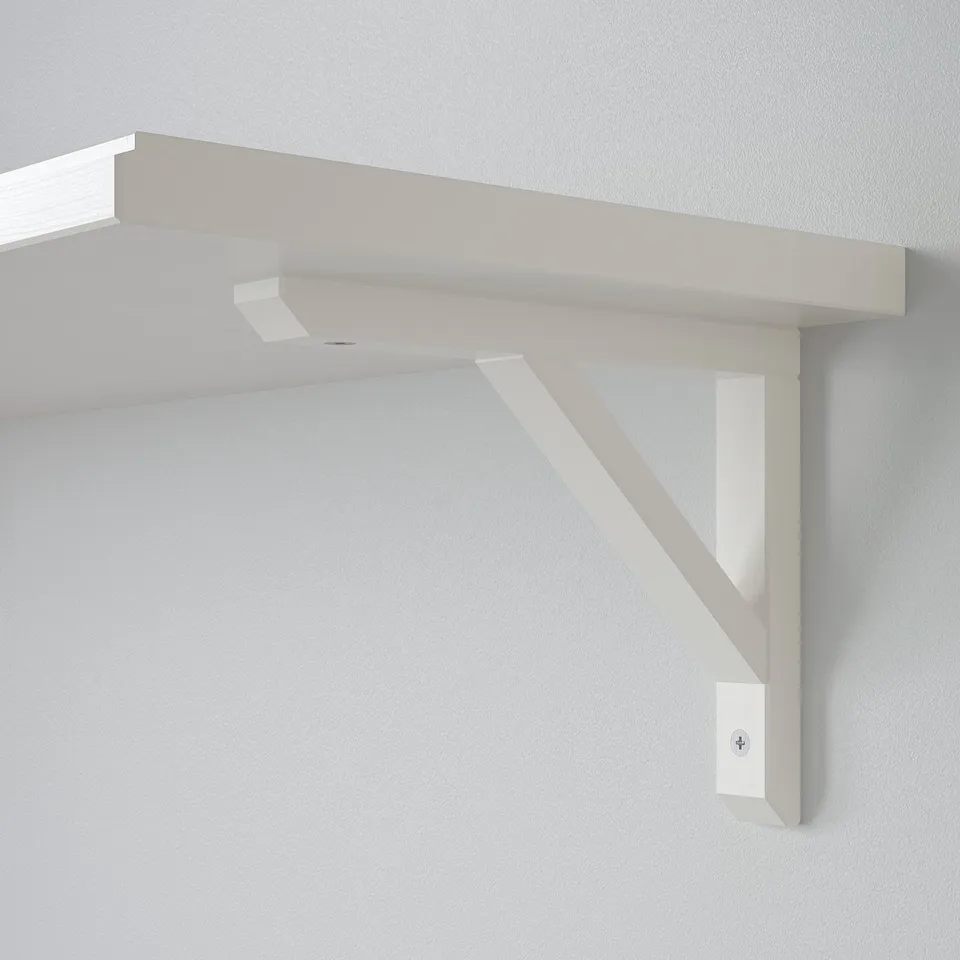 Clean, minimalist wall shelf mounted securely with sturdy brackets, ideal for modern decor.