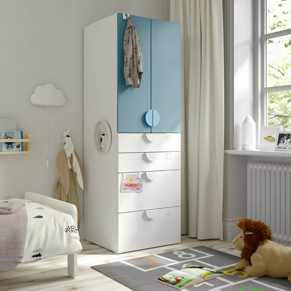 Modern kids room with blue/white SMÅSTAD wardrobe, adjustable drawers.