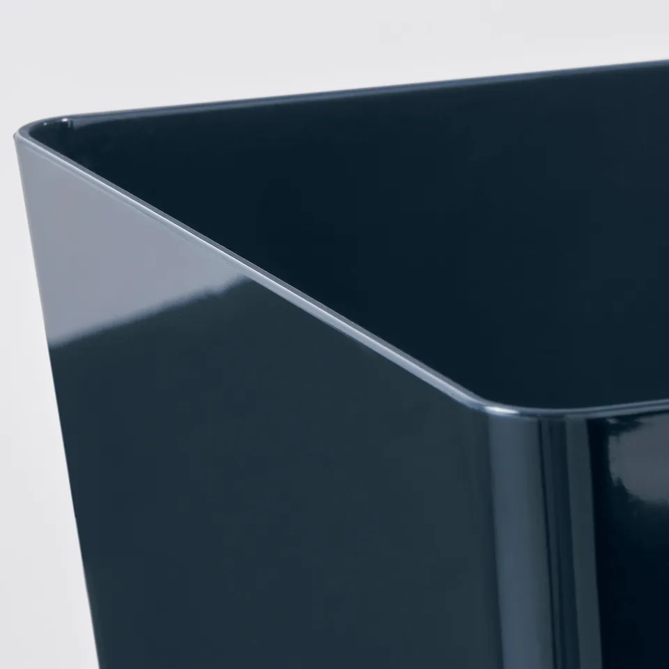 Clear, high-quality a sleek, dark blue plastic storage box, showing smooth, glossy finish and sturdy edges.