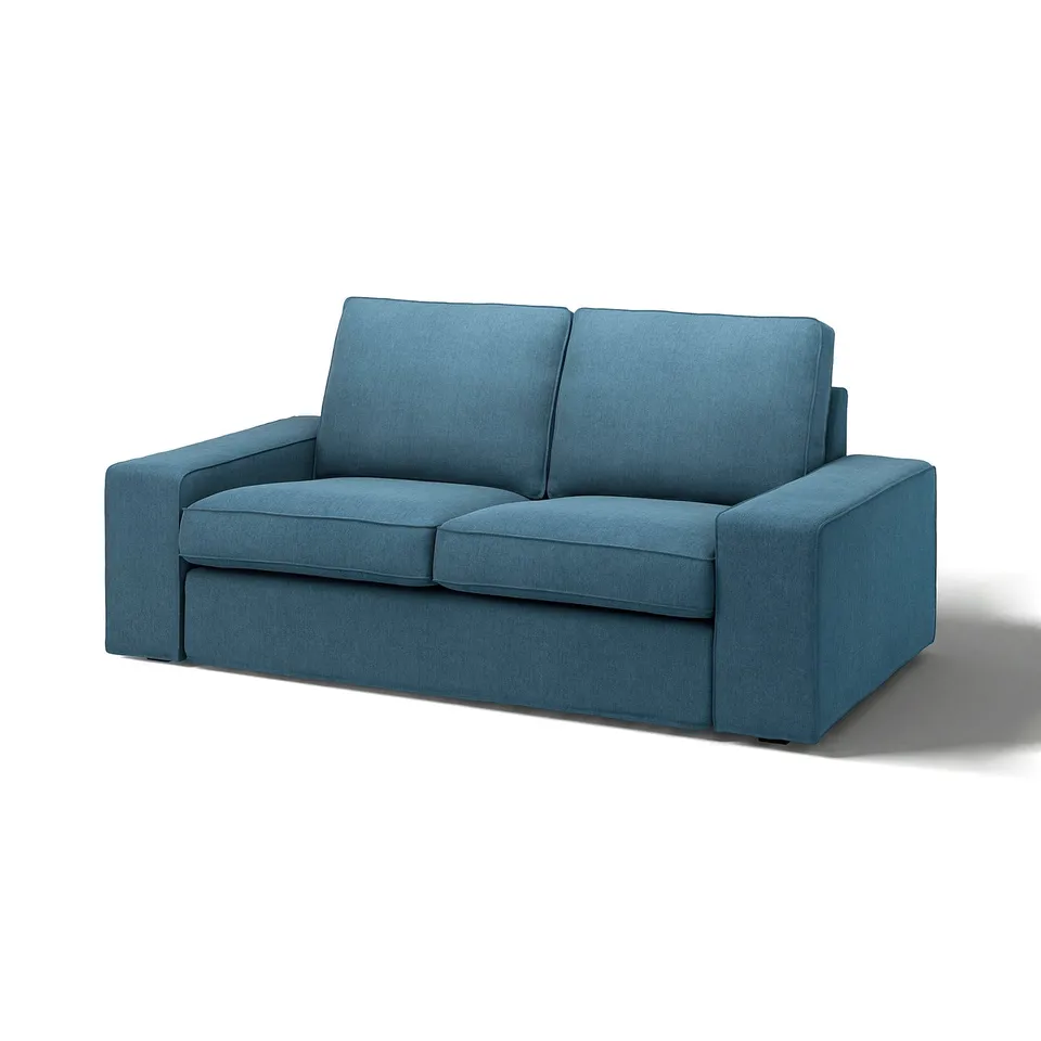 A modern teal blue KIVIK sofa with low armrests and boxy design, perfect for relaxation and socialising.
