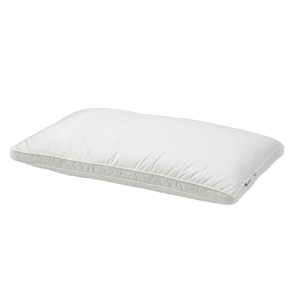 A white BERGVEN pillow with soft down and feather fill, double piping, and cotton cover.