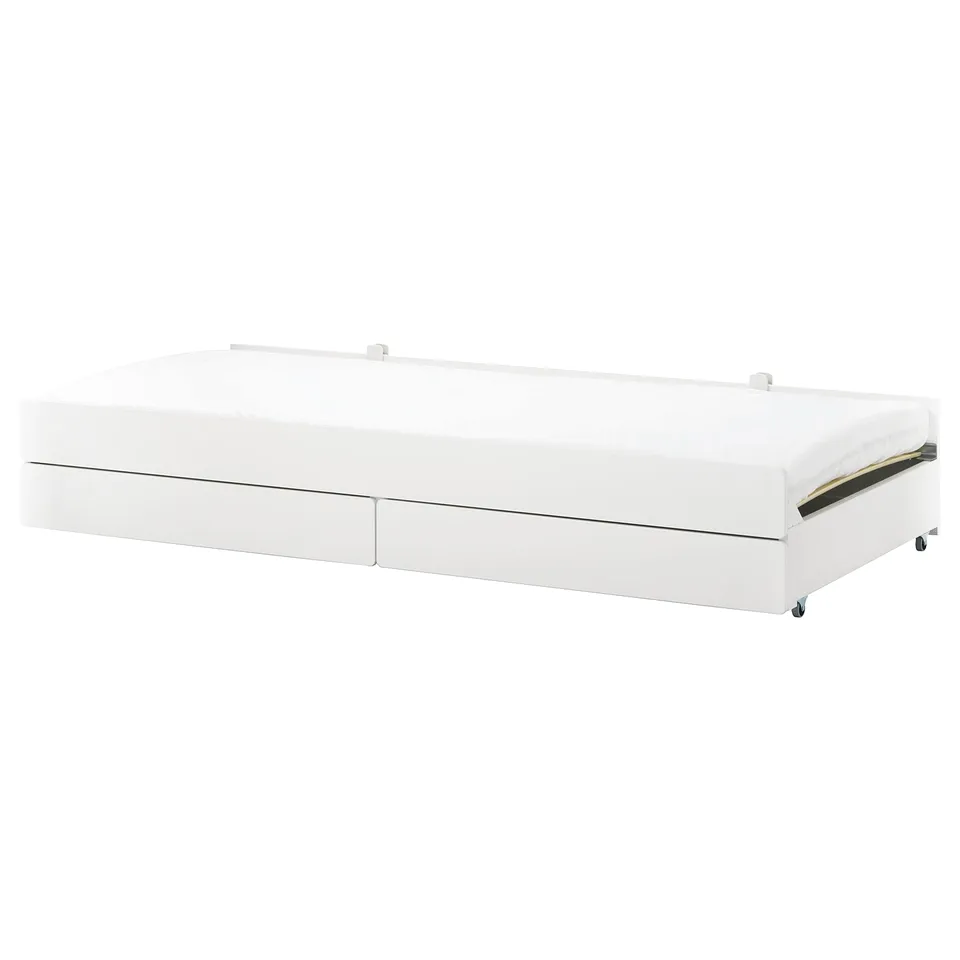 A white SLÄKT roll-out underbed with two drawers.