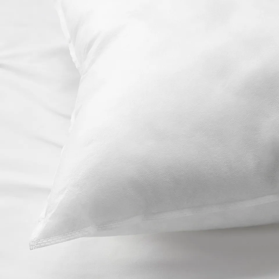 Clean, crisp white pillowcase with smooth, quality fabric, neatly folded.