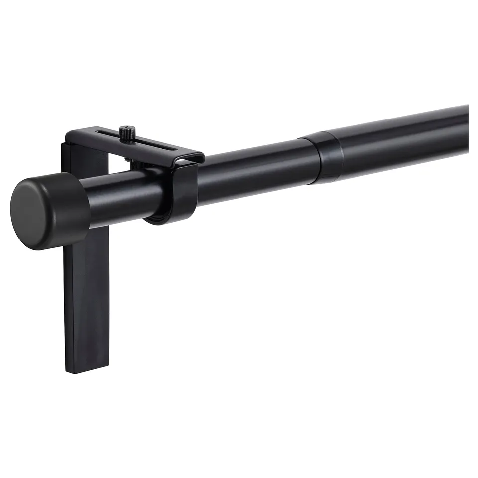 Black HUGAD curtain rod set with adjustable brackets and finials, made of steel and plastic.