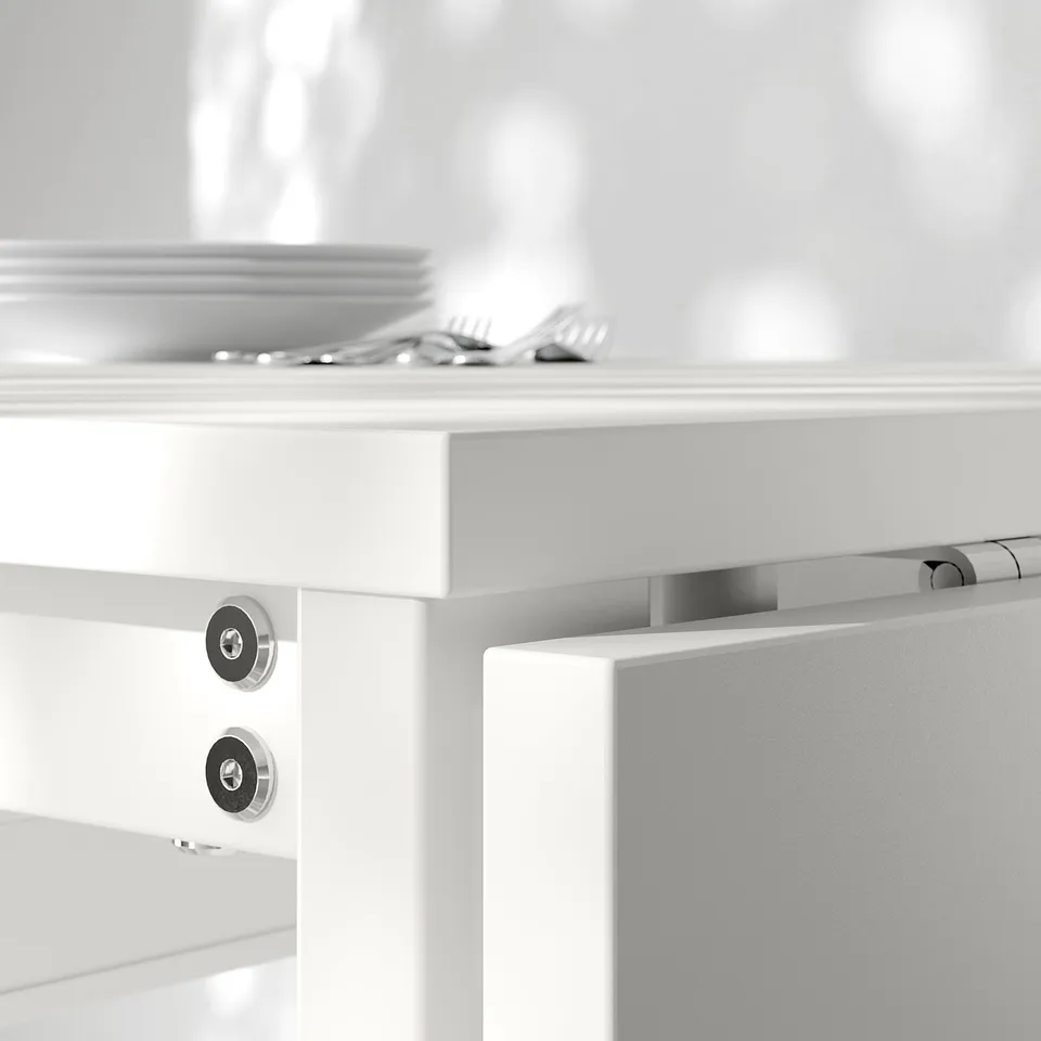 Close-up of durable, white powder-coated steel hinge on foldable table, showcasing quality construction.