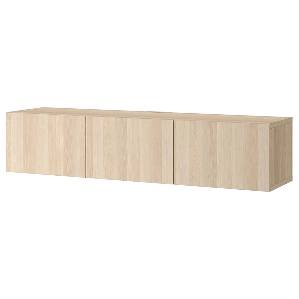 An ikea BESTÅ tv bench in white oak effect, rectangular, with four doors, wall-mounted, and light-colored wood design.