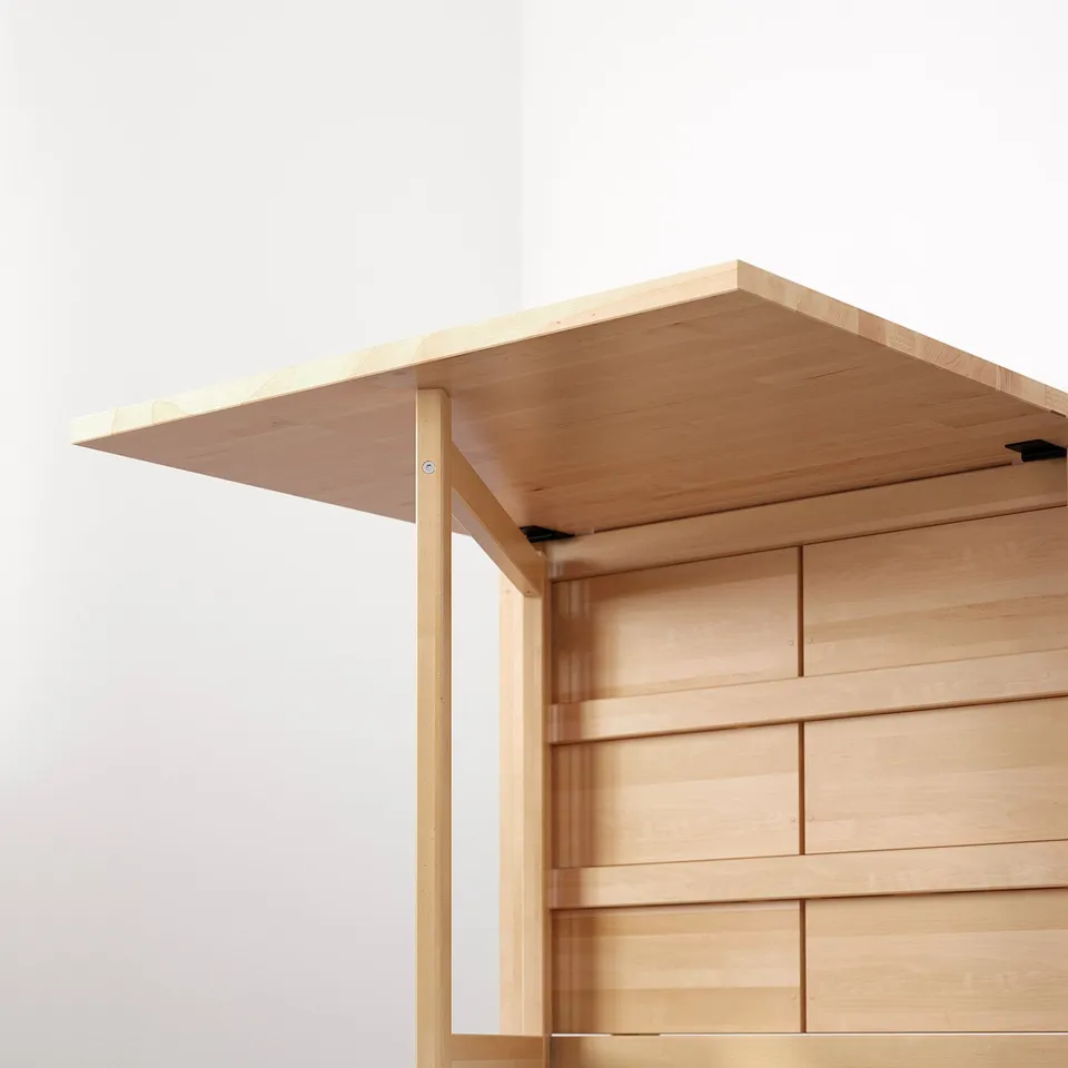 Light wooden table with adjustable leaves, perfect for indoor dining.