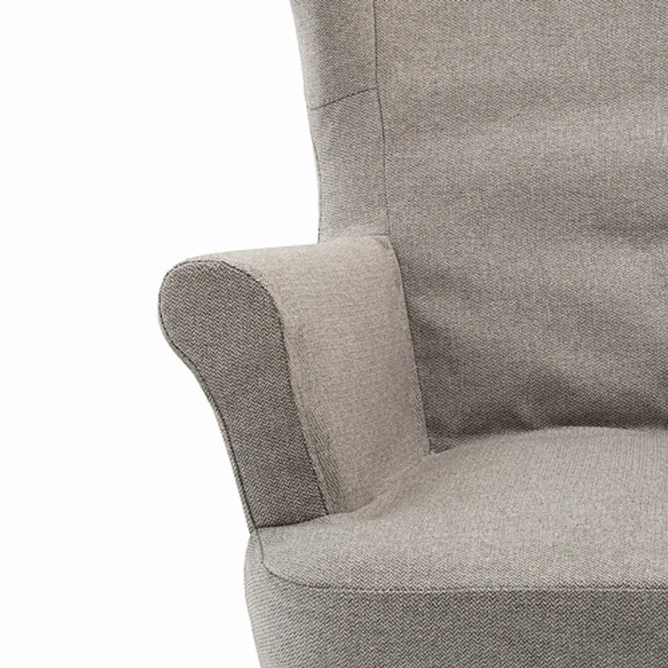 A close-up of a high-quality, upholstered armchair. The fabric appears durable and well-crafted, providing a comfortable and stylish seating option.