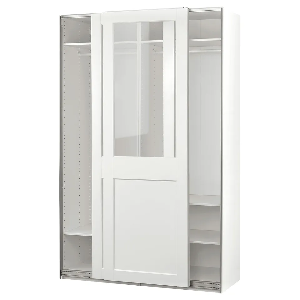A white PAX wardrobe with sliding glass doors. It has shelves and a clothes rail for storage.