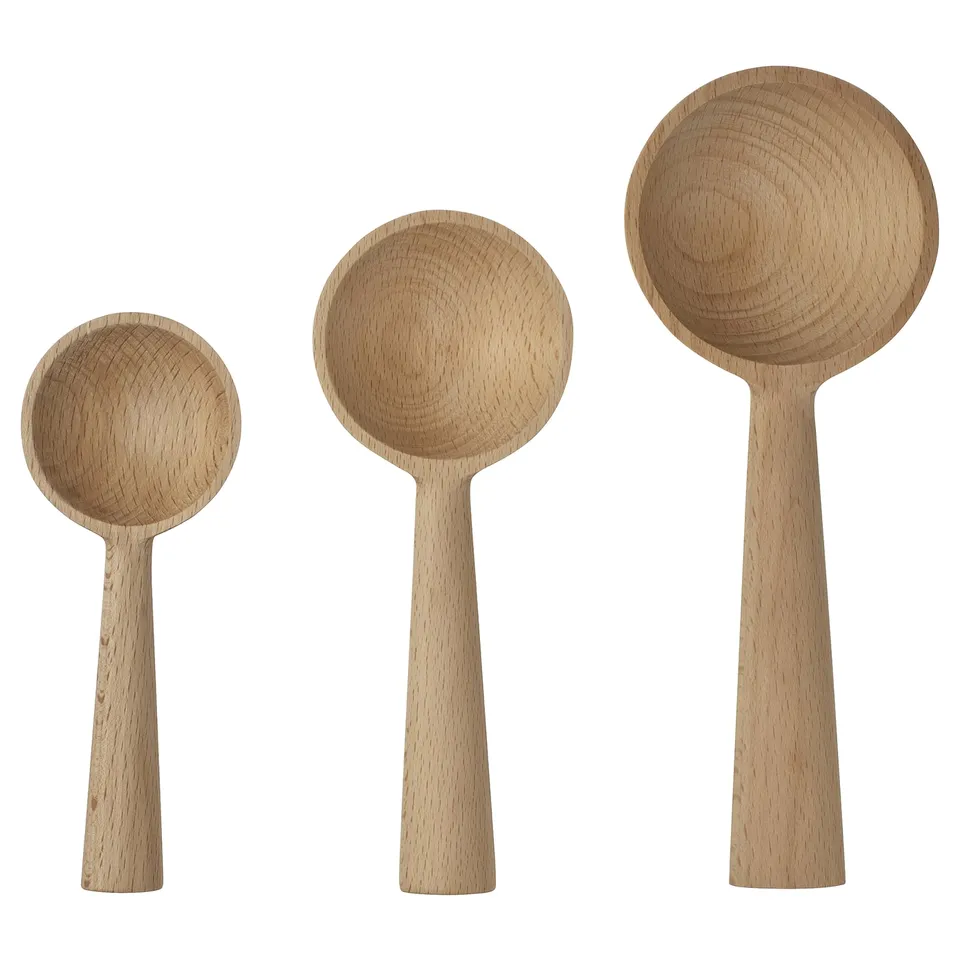 Three wooden spoons in varying sizes, light brown, displayed upright. Simple, elegant design.
