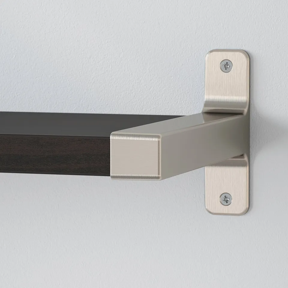Wall-mounted metal bracket supporting wooden shelf, showcasing sturdy and sleek design.