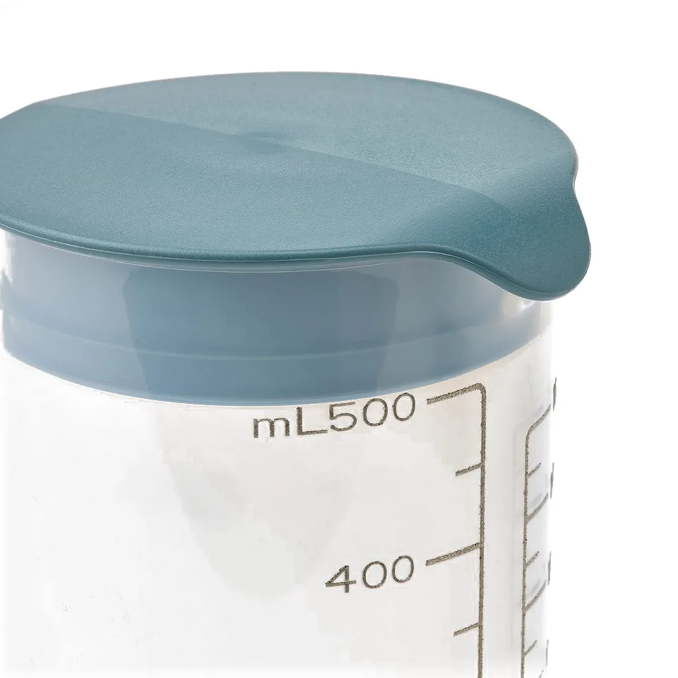 Clear plastic measuring cup with blue lid, marked ml 500 and 400, shows quality in its durable, leak-proof design.