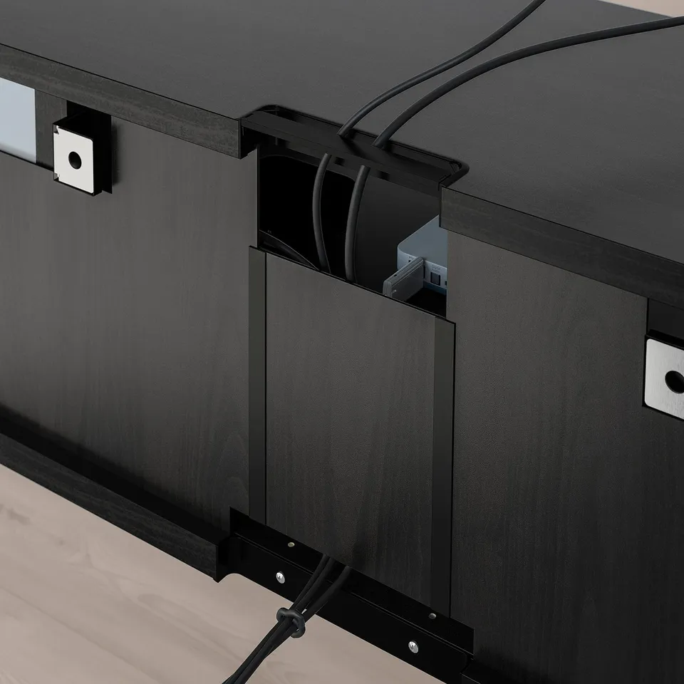 Black tv bench with adjustable shelves, cable management, and soft-close doors. Cables are neatly hidden and organised.