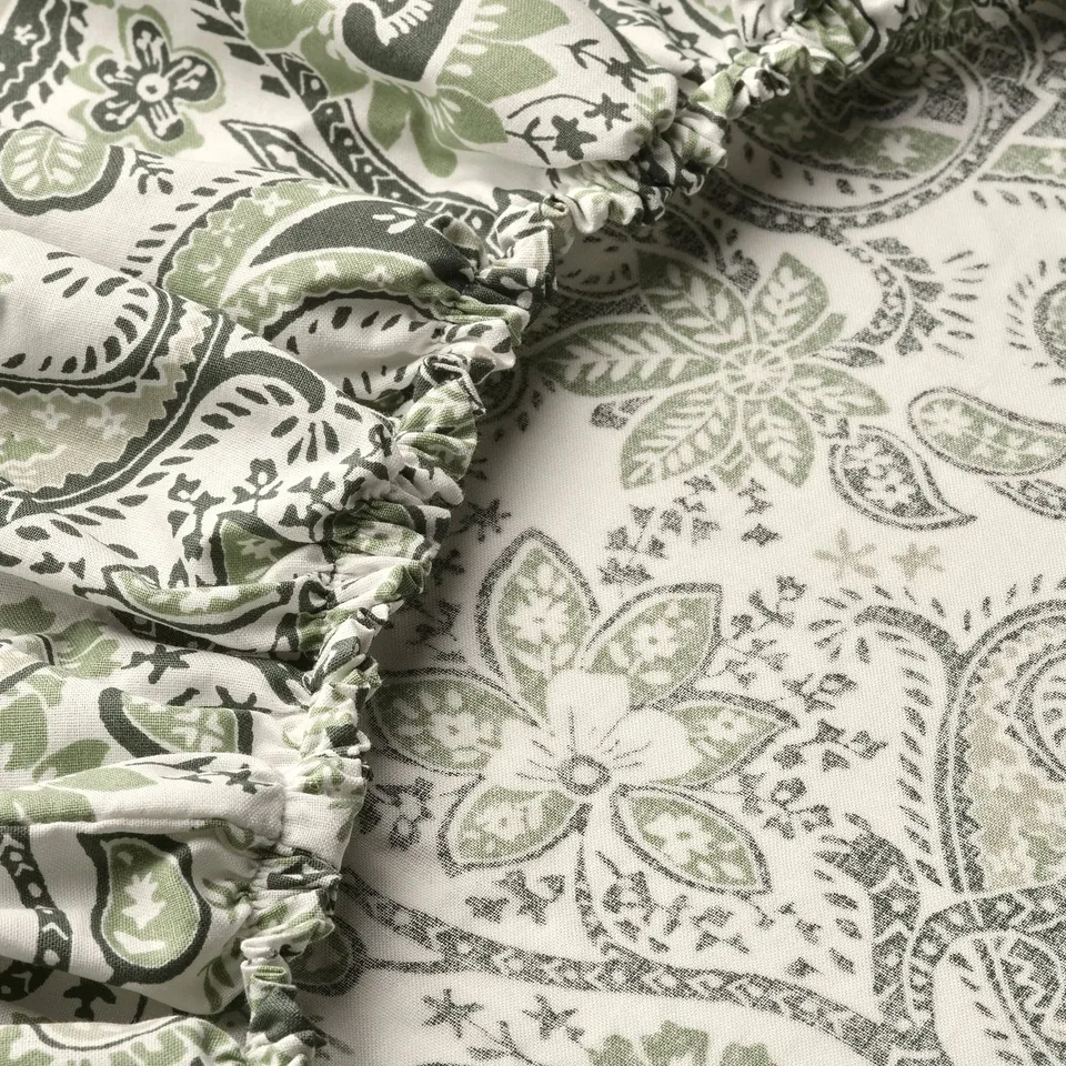 Paisley print fitted sheet, soft cotton-viscose blend, gathered edges, fresh green tones.