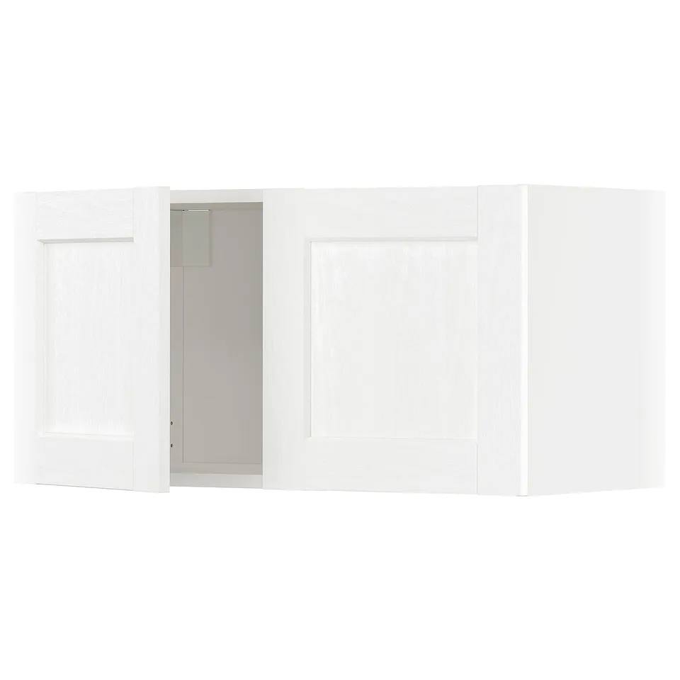 White METOD kitchen cabinet with one open door showing interior.