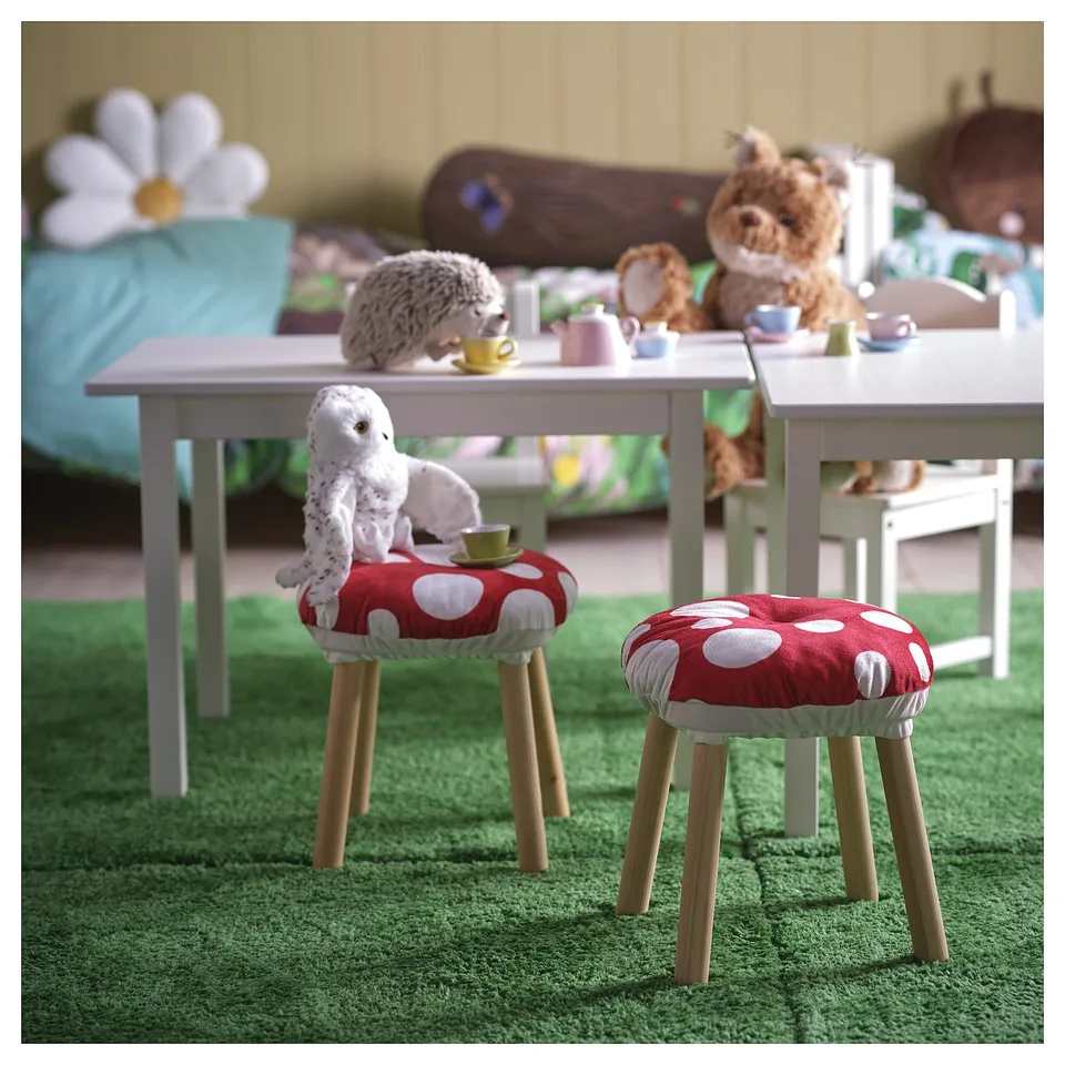 SKOGSDUVA mushroom cushion for kids, red/white dots, with wooden legs, eco-friendly.