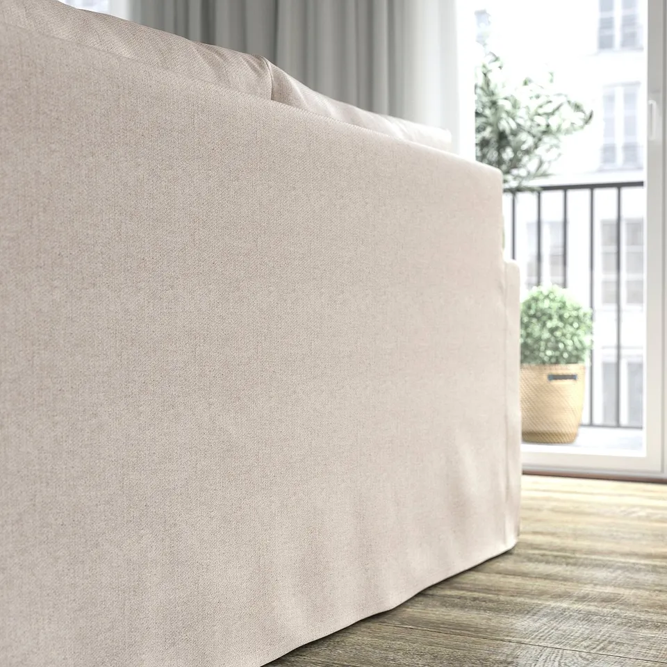 Sofa bed in light fabric, part of living room furniture.
