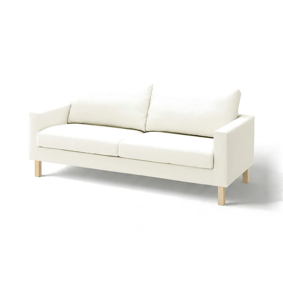 A white SALTSJÖBADEN sofa with light, textured fabric. It has a modern design with clean lines and four wooden legs.