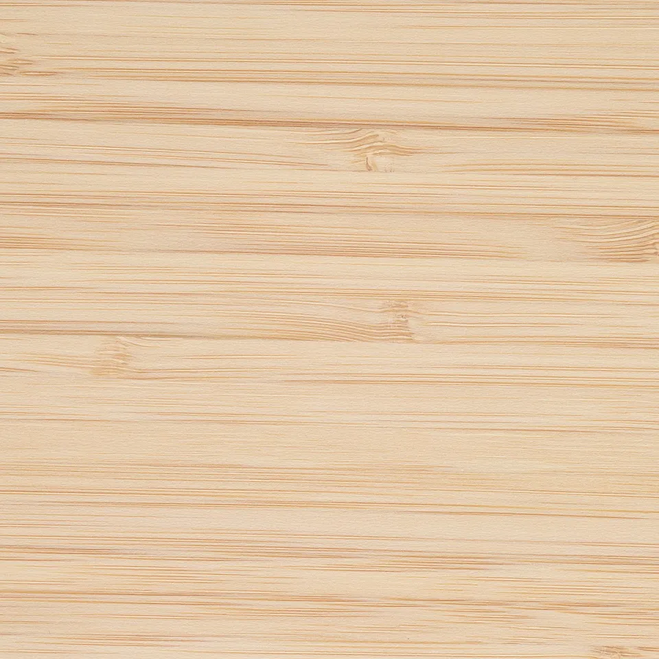 A close-up of smooth, light-colored bamboo, showcasing its fine, natural grain texture.