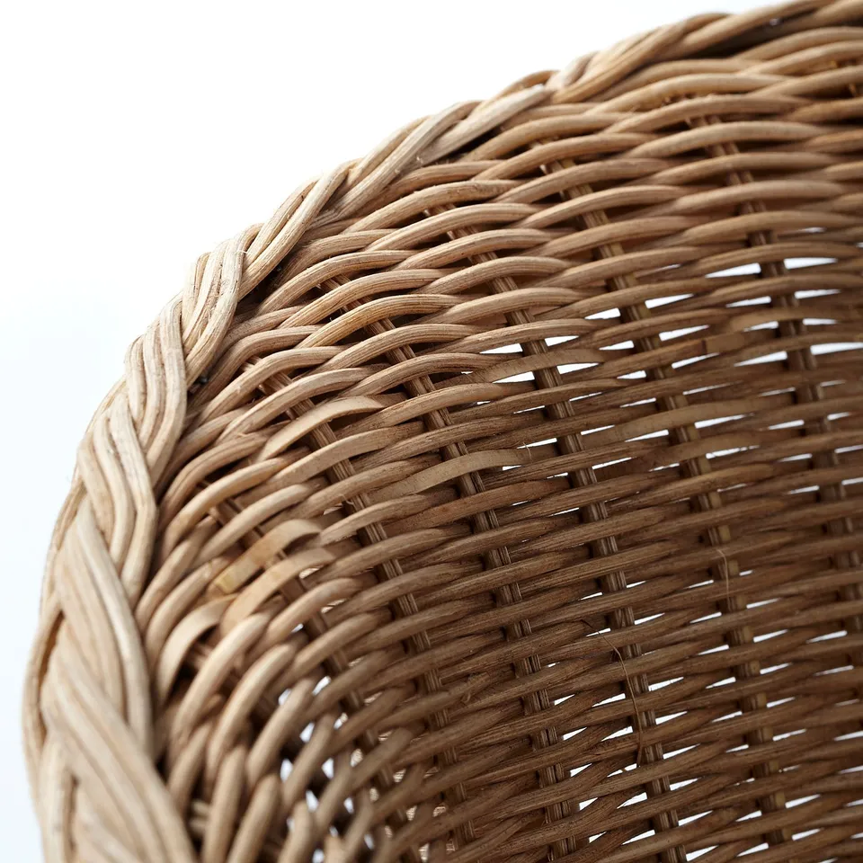 Handwoven rattan close-up: intricate, natural pattern.