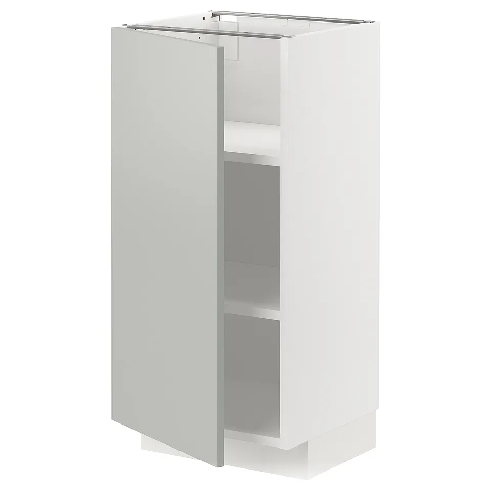 White METOD kitchen cabinet with grey shelves.