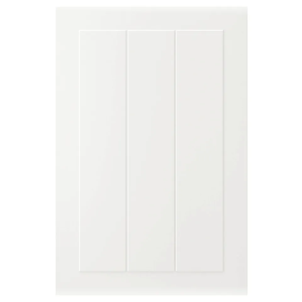A white STENSUND cabinet door with grooved panels. Its rectangular with a smooth, lacquered finish.